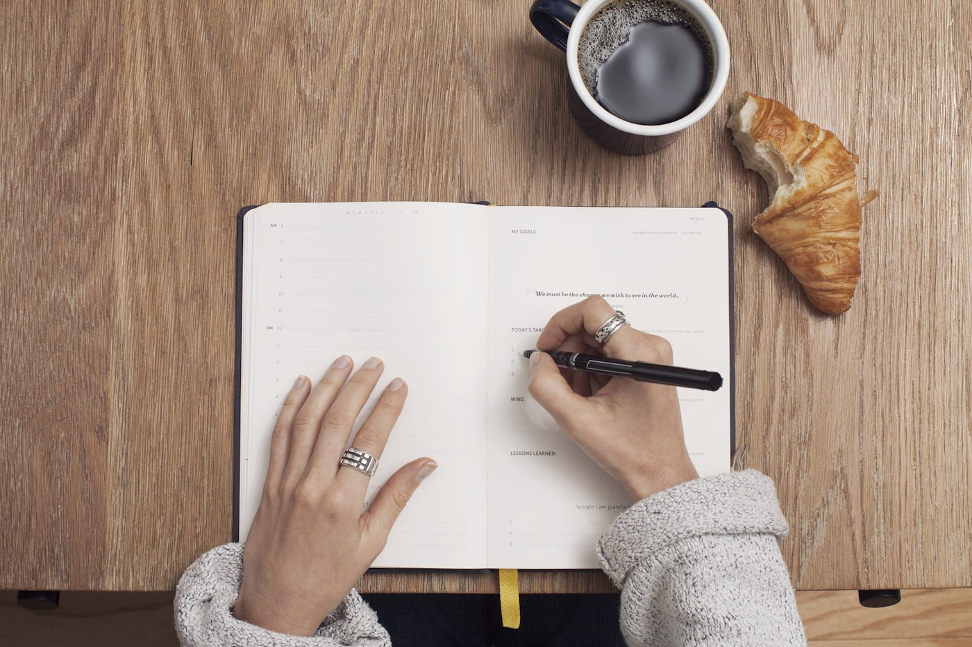 Notebook and pen used to prepare clear meeting notes